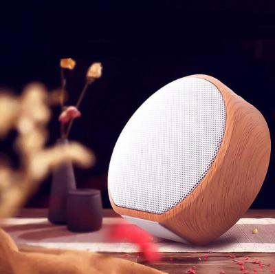 China 2022 function retro phone latest high quality portable mini subwoofer A60 wooden wireless speaker for sale