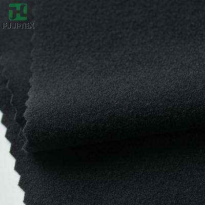 China Stretch 2023 New Arrival Brush 4 Way Stretch Softshell Polyester Spandex Fabric for sale