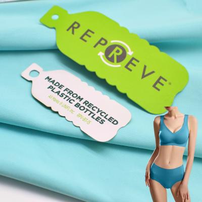 China Sustainable High quality GRS standard sustainable  plastic fabric for swimwear 80% recycled nylon 20%spandex fabric for sale