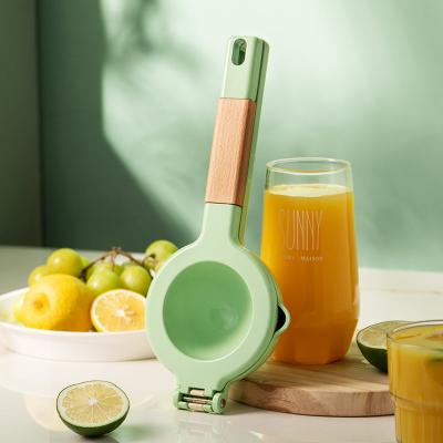 China Efficient juicing 2-in-1 lemon hand juicer citrus fruit squeezer double-layer sustainable manual lime juicer for sale