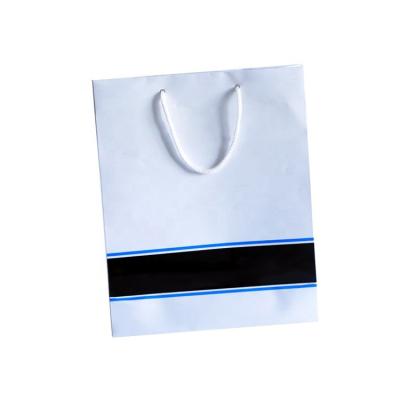 China Biodegradable Custom Paper Bag Logo Printed White Paper Bag With Handle for sale