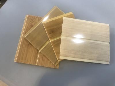 China Lightweight 8 Inch Pvc Wall Cladding With Wooden Groove For False Ceiling for sale