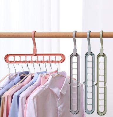 China Durable New Multifunctional Holes Plastic Hanger Cloth Hanger Room Saving Economic Hanger for sale