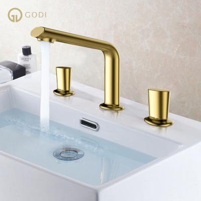 China Metered Faucets GODI Wholesale High Quality Luxury Faucets Sweep 3 Hole Faucets Gold Mixer Taps for sale