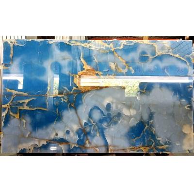 China Modern translucent marble cladding decoration wall panel onyx marmor sky blue gold veins match book onyx for wall for sale