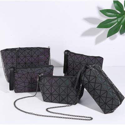 China New PU Fashion Luminous Geometric Bag Portable Wash Chain Bag Lingge And Cosmetic Storage Bag for sale