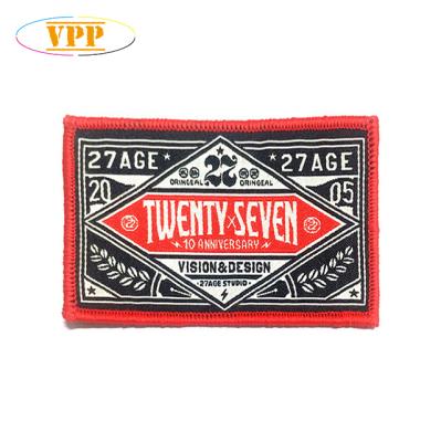 China 3D black woven patch with contrast red merrow edge for sale