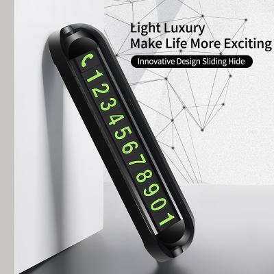 China Slide To Hide Car Accessories Temporary Night Light Mobile Phone Rotating With Scent Hide Number Parking Dashboard Plate Card for sale