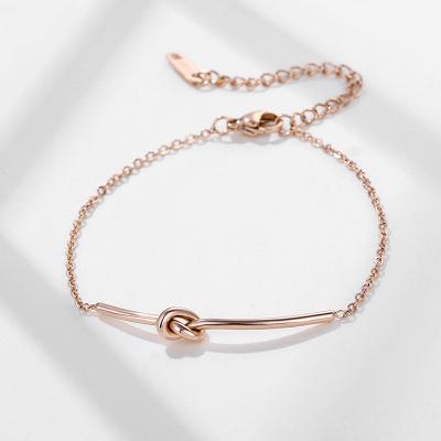 China Designer Minimalist Love Knot Charm CLASSIC Gold Plated Stainless Steel Bracelet For Women And Girls for sale