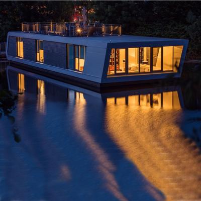 China Modern Water Building Holiday House Floating Houseboat Floating Prefab House for sale