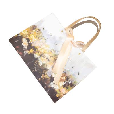 China Gift Paper Shopping Bag T-shirt Handmade Custom Printed Luxury Foldable Waterproof Shopping Bag For Packaging for sale