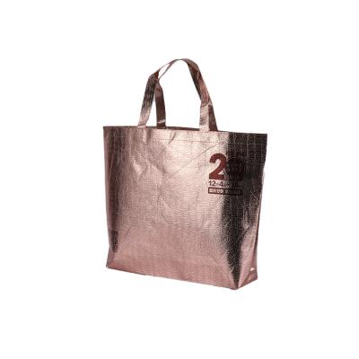 China 100% eco-friendly non-woven ribbon woven fabric non-woven packaging bag eco-friendly portable non lamination metallic shopping bags for sale