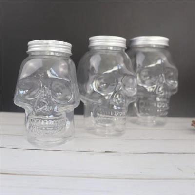 China 350ml 500ml 800ml Plastic Coffee Pet Beverage Bottle Snack Storage Container Skull Shape Bottle For Juice With Cap for sale