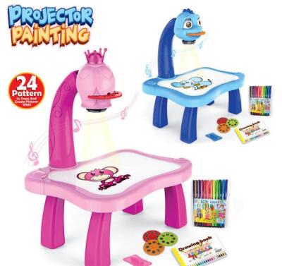 China 2021 yaya toys kid learning desk with projector smart kids painting table toys with free light and music for sale