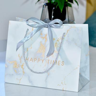 China Luxury Marble Reused Materials Gift Shopping Bags With Logos Bolsas De Navidad De Papel for sale