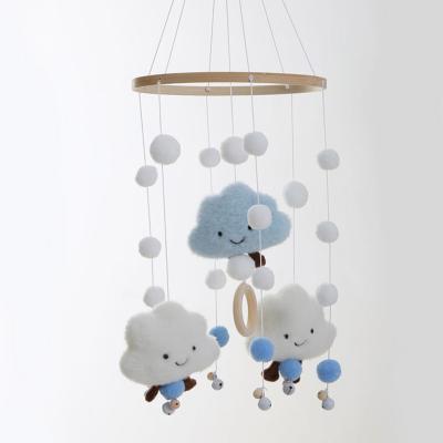 China Novelty Crib Bell Ornament Decoration Toys Minimalist Rotating Hanging Hairball Clouds Sensory Wind Chimes Crib Bell Pendant Gift for sale