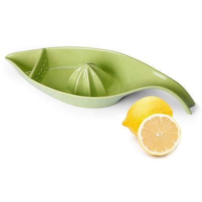 China Viable Ceramic Pot Citrus Juicer Stoneware Lemon Squeezer With Manual Boat Shape Fruit Reamer for sale