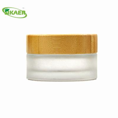 China Personal Care Frost Glass Empty Bamboo Jar 15ml 30ml 50ml 100ml Recyclable Cosmetic Packaging for sale