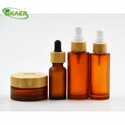 China Personal Care China Manufacture 2019 Design Gel Glass Cream Jar Amber Bamboo Glass Cream Jar Cap 30ml 100ml Perfume Bottles for sale