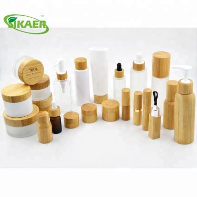 China Recycle 100g Frost Glass Jar With Lid Bamboo Wooden Cosmetic Packaging Cream Jar Coffee Cup for sale