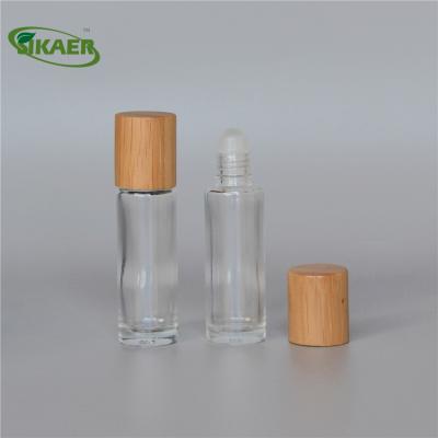 China Empty Bamboo Material Refillable Personal Care Perfume Roll On Bottle With Metal Roller for sale