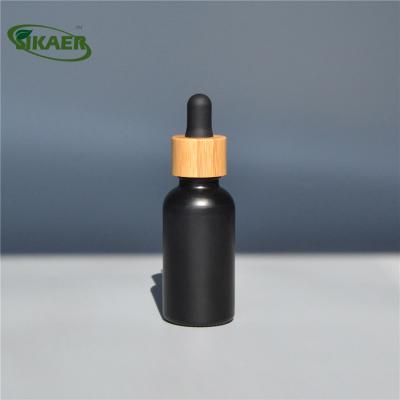 China Material Supply Recyclable Sample 10ml 30ml 50ml 1oz Frosted Clear Amber Blue Green Glass Essential Oil Dropper Bottle With Bamboo Lid for sale