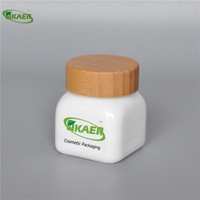 China Personal Care 10g 30g 50g Ceramic Luxury Cosmetic Containers Recycle Bottle With Bamboo Lid Packaging Jars for sale