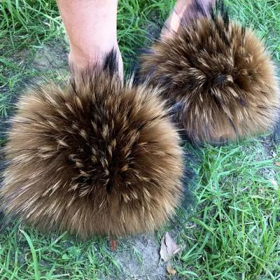 China Fashion Trend Fluffy Fur Big Slips Fashion Big Fur Slippers Raccoon Fur Slides for sale