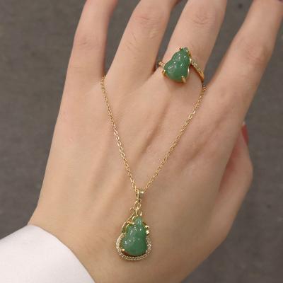 China Durable Titanium Steel Chain Iced Out Natural CZ Emerald Jade Pendant Necklace for sale