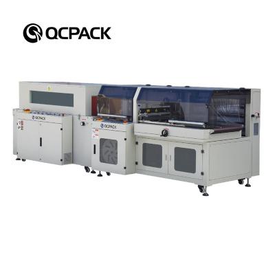 China Automatic CLOTHING Film Shrink Packing Machine For Cosmetic Industry for sale