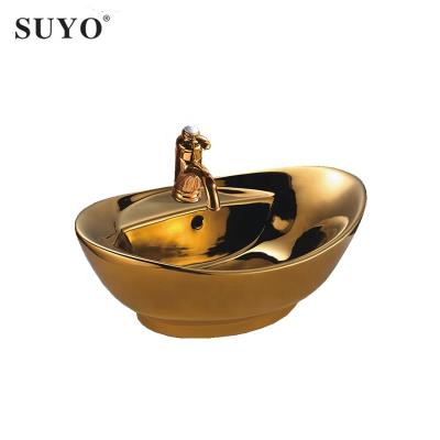 China Modern Luxury Ceramic Bathroom Oval Shape Gold Painting Over Counter Sink Gold Color Art Basin for sale