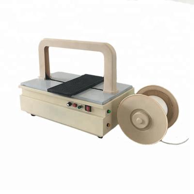 China Automatic Commodity Tray Plastic Wrapping Machine With Strap Wrapping for sale