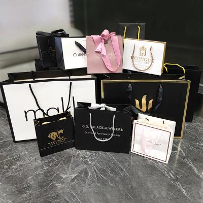 China Recycled Materials OEM Customized Printed Famous Brand Luxury Retail Apparel Jewelry Shopping Paper Gift Bags With Your Own Gold Embossed Logos for sale