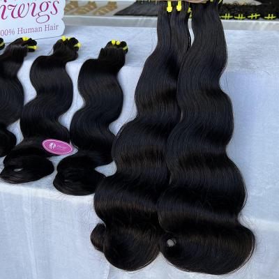 China Kinky Curl Wholesale Natural Black Color Body Wave Hair Extension Bundles Raw Mink Virgin Cambodian Hair Bundle Vendors for sale