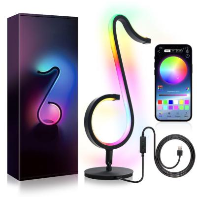 China Bedroom Modern Remote Control Bedside APP Decoration RGB LED Musical Note Light Wall Lamp Ambient Lighting Table Lamp for sale