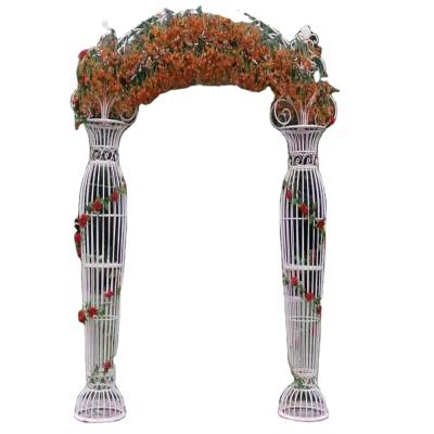 China Shooting arch modern European wedding garden props and iron frame wedding admission white flower gate ornaments for sale