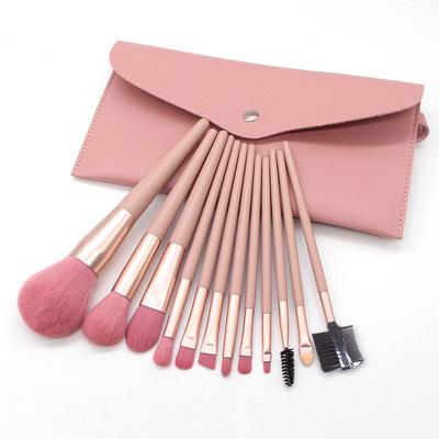 China Angular Blush Makeup 12pcs Personalized Pink Brushes Beauty Tools Powder Blush Eyeshadow Brush Set Makeup Bag for sale