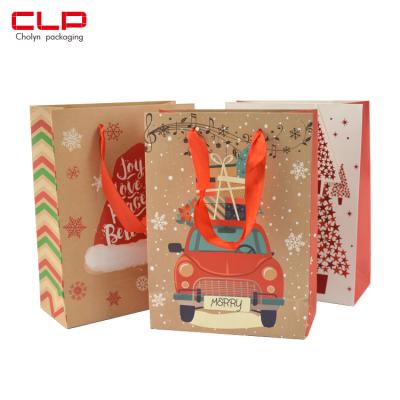 China Various Styles Of New Design Christmas Wrapping Paper Candy Bag Recyclable Gift Holiday Shopping Bags With Logo Pattern Custom Made for sale