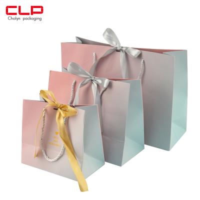 China Recyclable Luxury Gradient Color Ribbon Handle Shopping Package Recyclable Paper Shopping Bag With Ribbon And Custom Logo for sale