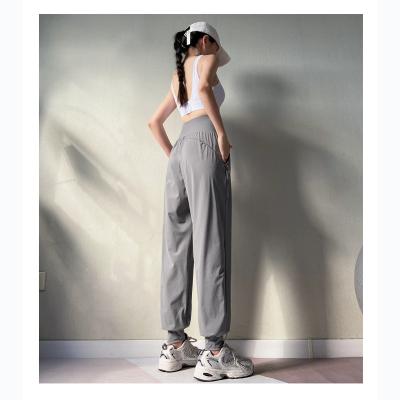 China OEM 2023 Breathable Extrude Drawstring Yoga Pants Fashion Long Pants High Quality Solid Color Comfortable Women Pants Plus Size Pants for sale