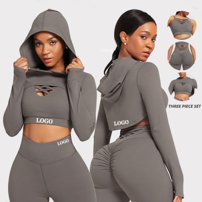 China High Quality Breathable Hooded Crop Top Solid Color Women Fitness 3 Piece Yoga Cutout Activewear Yoga Sets for sale