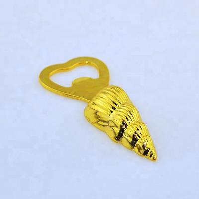 China Sea Viable Custom Wedding Favor Golden Shell Shaped Metal Bottle Opener for sale