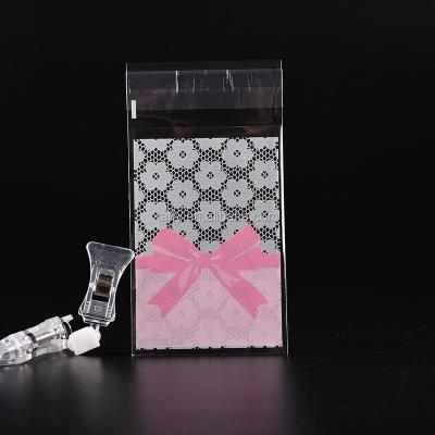 China Disposable Cake Gift Wraps Cute Design Plastic Pink Bow Candy Bag Cute OPP Package Paper Package for sale