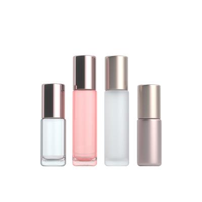 China Shiny pink gold / matte rose gold makers stock cosmetic packaging 5ml/10ml material eye cream roll-on bottle empty rose sleeve frosted glass bottle gold ball for sale