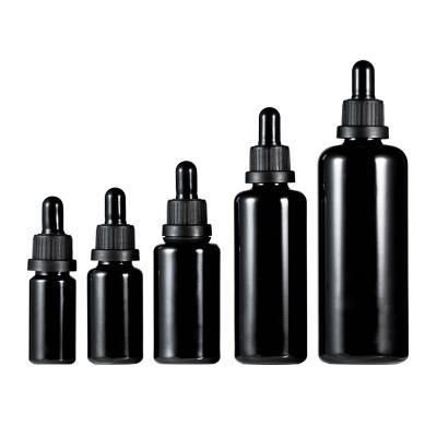 China Suitable for two color cosmetic black and white plastic head material packaging essences packaging essential oil subbottling black dropper glass bottle bottle for sale