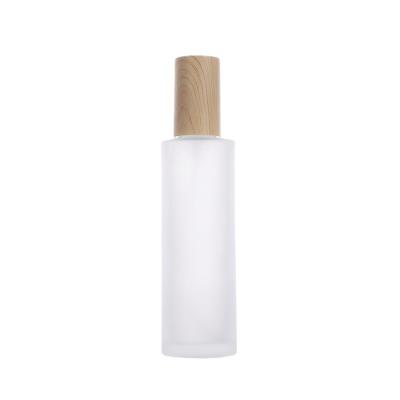 China Various Specifications Cosmetic Water And Milk Subbottling Portable Wood Grain Cover Transparent Frosted Glass Lotion Bottle Spray Bottle for sale