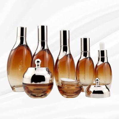 China Eco-friendly luxury unique custom cosmetic glass set of skincare packaging set 40ml 100ml 120ml pump dropper bottle and jar set for sale