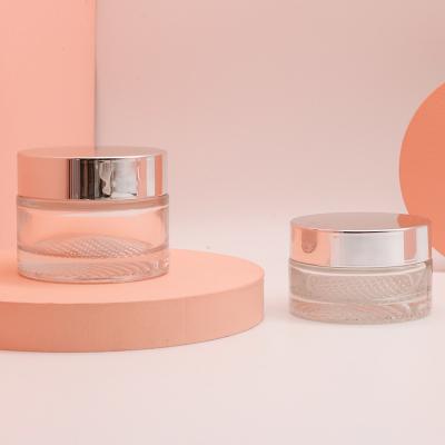 China Hot Selling Empty Cosmetic Jar 30g 50g Round Shape Face Cream Luxury Glass Jar Eco-friendly With Silver Screw-on Lid for sale