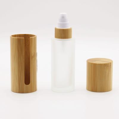 China High Quality Eco-friendly Bamboo Cosmetic Packaging 50ml Full Glass Custom Frosted Clear Empty Lotion Bottle With Pump for sale