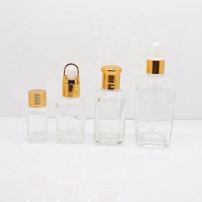 China Personal Care Square Shape Clear Glass Bottles For E Liquid Essential Oil 15ml 25ml 35ml 50ml 100ml for sale